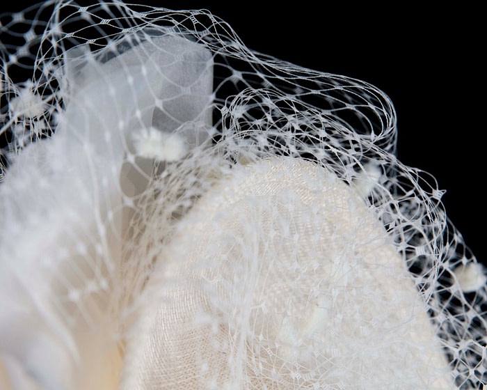 Cream racing fascinator with flowers and face netting by Fillies Collection - Image 3