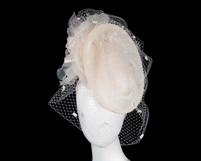 Cream racing fascinator with flowers and face netting by Fillies Collection