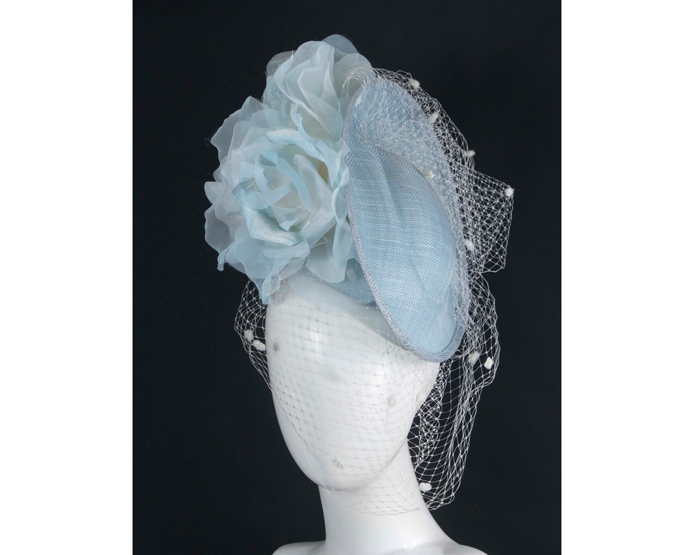 Traditional light blue fascinator with flowers and face veil