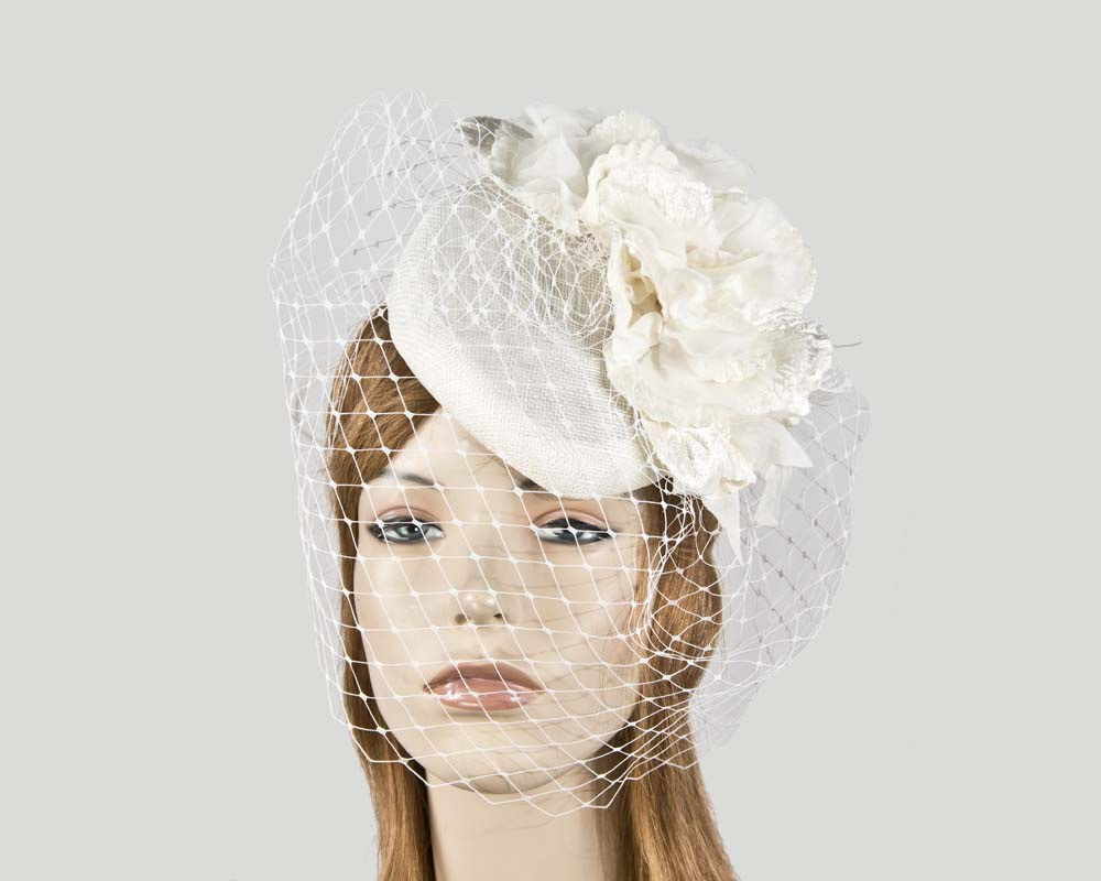 Cream flower pillbox with face veiling