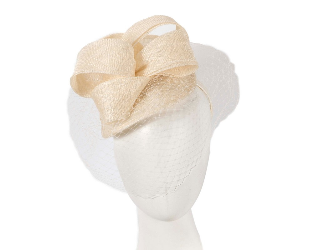 Cream fascinator with face veil by Max Alexander