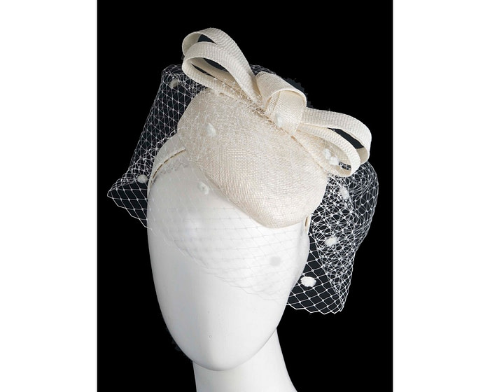 Cream pillbox hat with veil by Fillies Collection